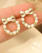 Pearl Bow Korean Zircon Earrings for Women – Elegant Bowknot Design with Sparkling Zircon and Pearl Accents | Premium Golden and Silver Fashion Jewelry for Weddings, Parties, and Everyday Wear | AXT-100